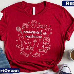 A red t-shirt with the text "moves medicine" printed on it, surrounded by various fitness-related icons such as a tennis racket, dumbbells, and a yoga mat.