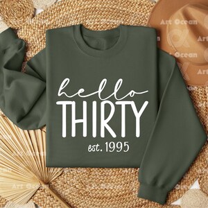 a green sweatshirt with the words hello thirty on it