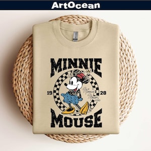 a mickey mouse shirt hanging on a wall