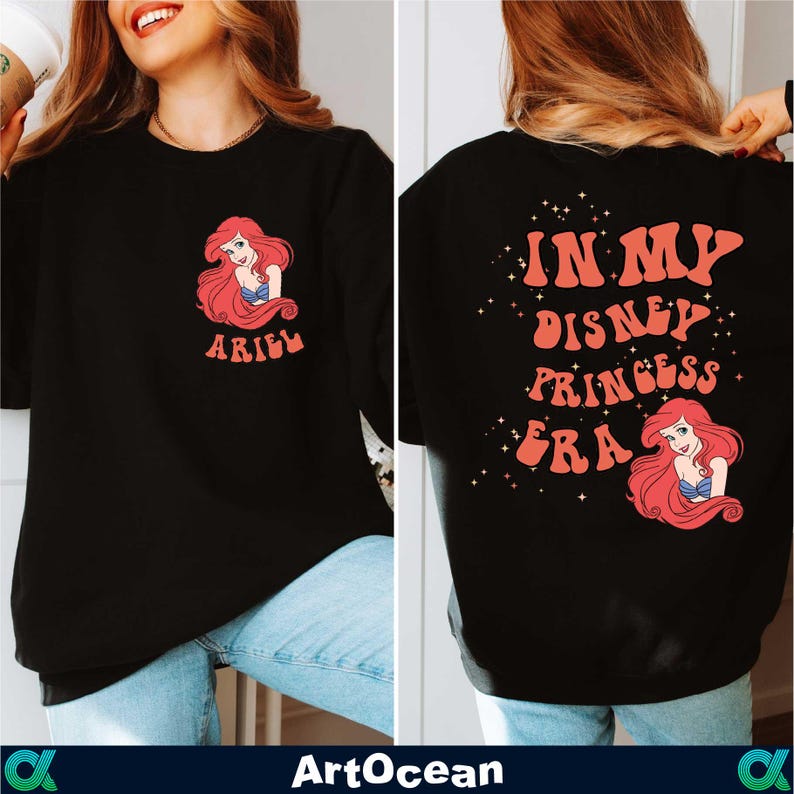 a woman wearing a black shirt that says i'm my disney princess ariel