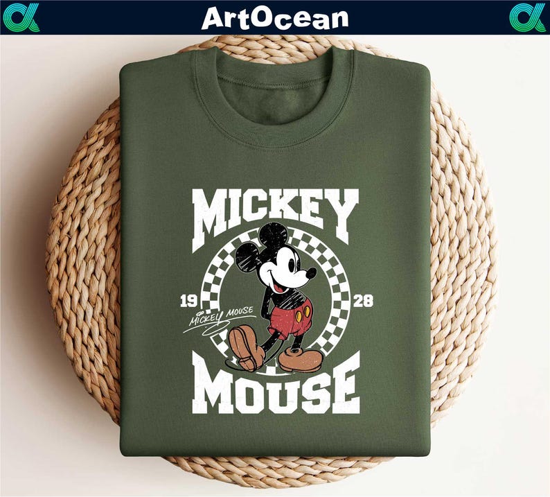 a mickey mouse t - shirt sitting on top of a basket