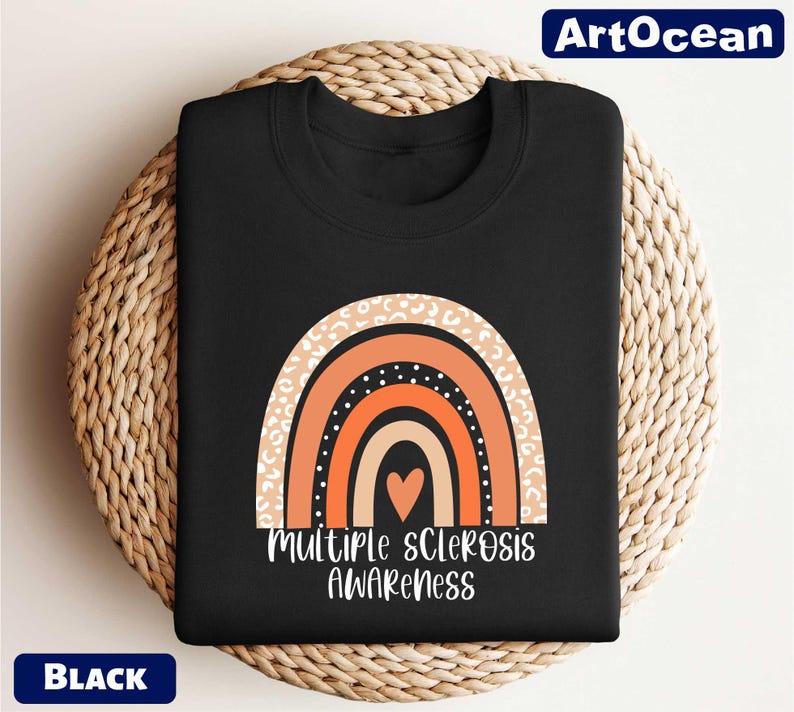 a black t - shirt with an orange and white rainbow on it