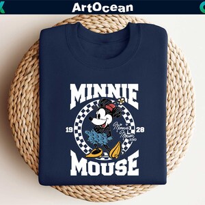 a mickey mouse t - shirt on a wicker basket