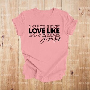 a pink shirt that says love like love like jesus