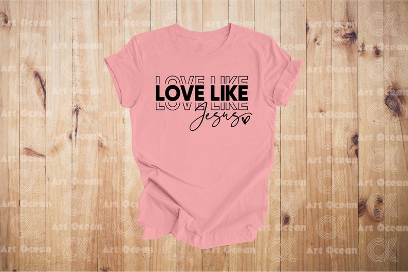 a pink shirt that says love like love like jesus