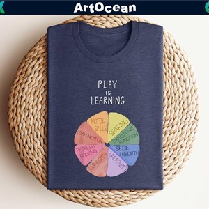 a t - shirt that says play is learning on it