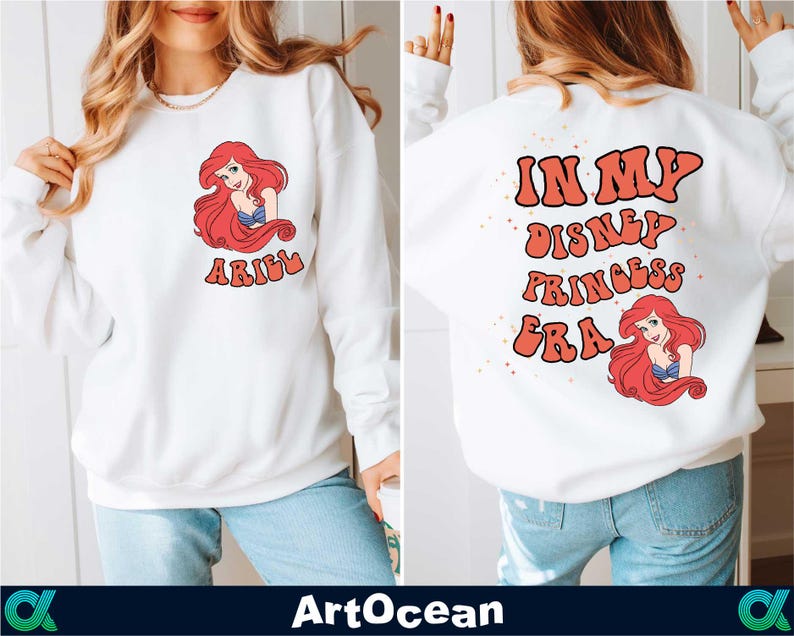 a woman wearing a white sweatshirt with the words i am disney princess on it