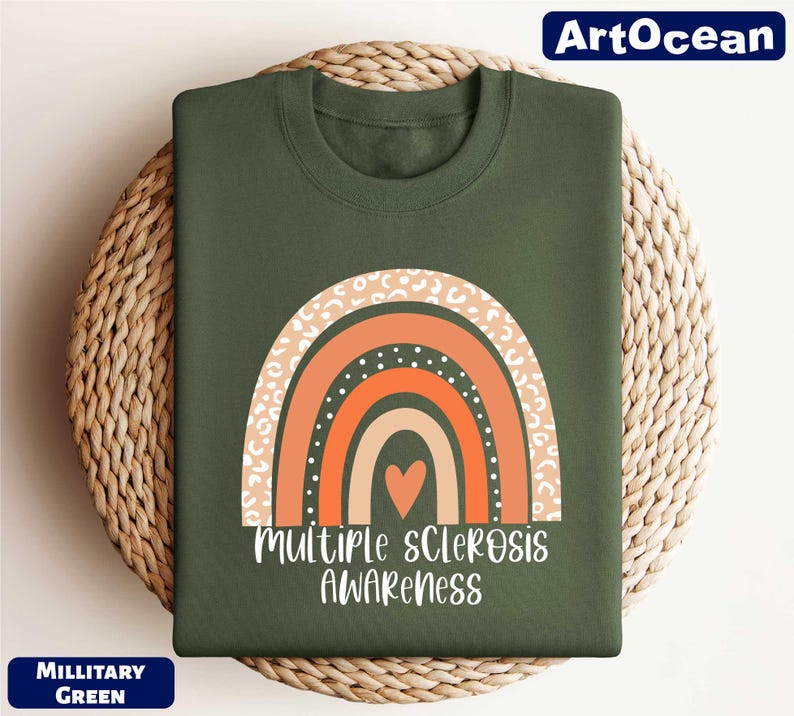 a green t - shirt with a rainbow and the words multiple scrabbles