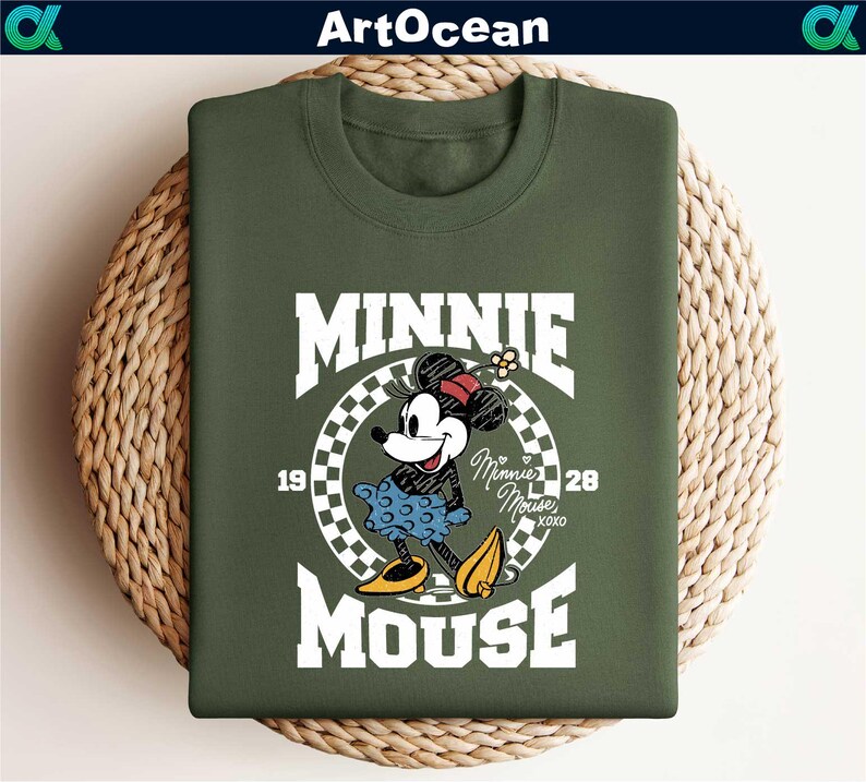 a green shirt with a mickey mouse graphic on it
