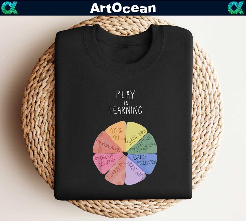 a black t - shirt with the words play and learning on it