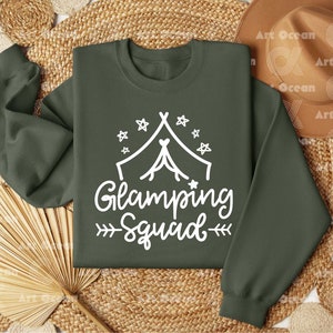 a green sweatshirt with the words glamping squad printed on it