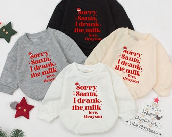 May include: Four Christmas-themed sweatshirts in different colors: black, gray, white, and beige. Each sweatshirt features a red graphic with the text "Sorry Santa, I drank the milk. Love, Grayson".
