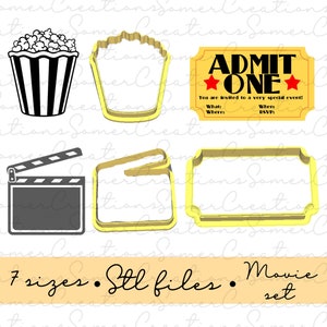 May include: A selection of film-themed cookie cutters and a popcorn graphic. Includes a popcorn bucket, ticket, film clapper, and other shapes. The text "ADMIT ONE" is visible on the ticket. The set includes 7 sizes and STL files.