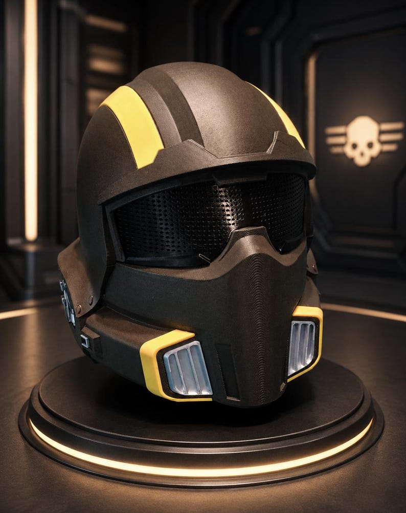 May include: A matte black helmet featuring bold yellow stripes running across the top and yellow accents around the lower vents. The helmet includes a dark, perforated visor and silver-coloured vertical intake grilles on the front chin guard.