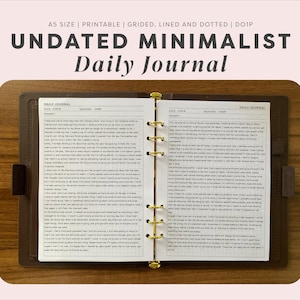 May include: An open A5 daily journal with a brown cover and gold-toned ring binder mechanism. The white pages feature a grid layout with printed headers for date, weather, and prompts, filled with handwritten text in black ink on both sides.