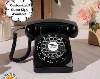 May include: A black rotary phone with a dial and handset. The dial features the text "Leave a Message." The phone has a cord and is on a white surface. Text on the image says "Customized Guest Sign Available" and "Lovely Voicemail."