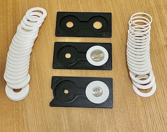 Herramienta de centrado para perforar anillos de monedas