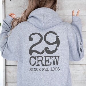 May include: Gray hooded sweatshirt with the text "29 Crew Since Feb 1996" printed on the back.