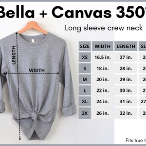 May include: A gray long-sleeve crew neck t-shirt with a size chart showing measurements in inches. The chart includes sizes XS, S, M, L, XL, and 2X. The t-shirt is Bella + Canvas 3501.
