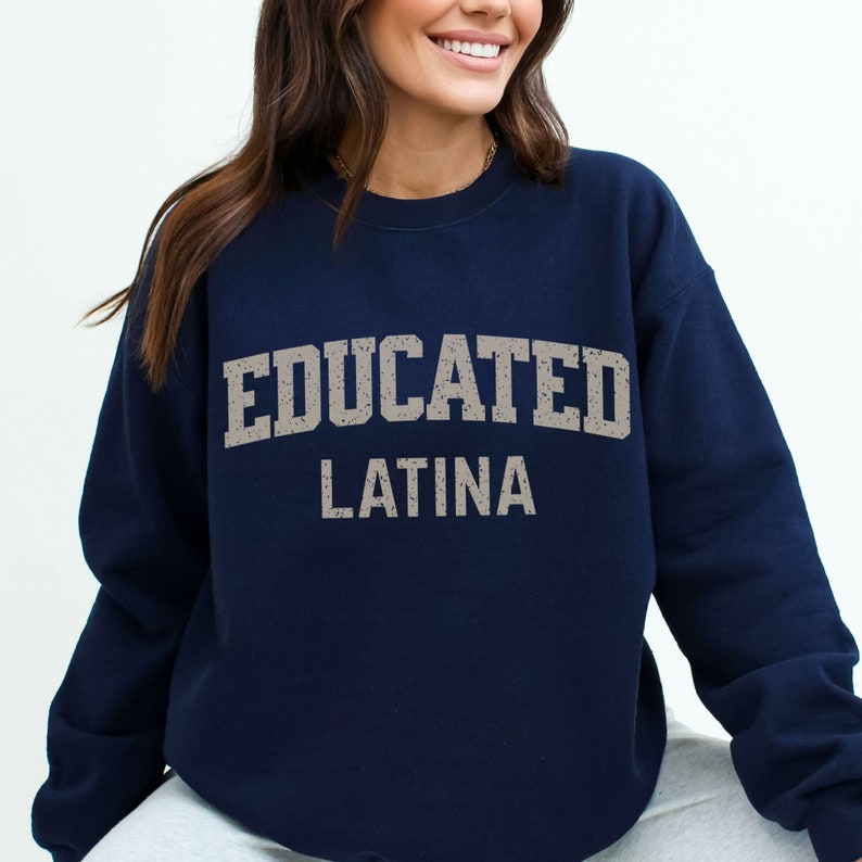 May include: Navy blue sweatshirt with the text "EDUCATED LATINA" in a distressed white font.
