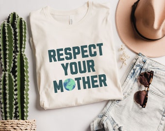 May include: A white t-shirt with the text "Respect Your Mother" in dark teal blue letters. A green and blue globe graphic is centered below the text.