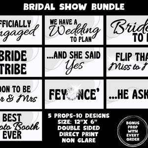 May include: A set of 10 bridal shower photo booth props with white backgrounds and black text. The props feature phrases like "Officially Engaged", "Bride Tribe", "...And She Said Yes", "Flip That Miss to Mrs", "Soon to Be Mr & Mrs", "Feyonce', "...He Asked", and "Best Photo Booth Ever". The props are 12 inches by 6 inches and are double-sided.