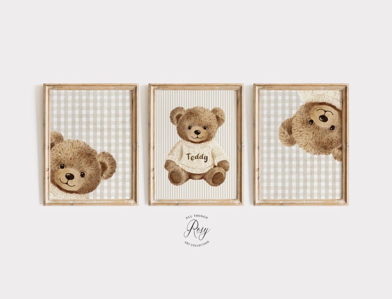 May include: A set of three framed prints with watercolour illustrations of teddy bears. One bear is centered, wearing a sweater with "Teddy" on it. The other two prints show the bear's face peeking from the side. The background is a light beige and white checkered pattern.