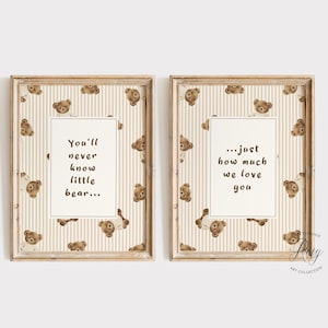 May include: Two framed wall art prints featuring a repeating pattern of brown teddy bears on a beige and white vertical striped background. The left print displays the text You'll never know little bear... and the right print displays ...just how much we love you.