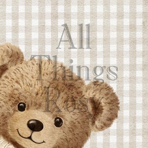 May include: A watercolour illustration of a teddy bear wearing a cream-coloured sweater. The bear has brown fur, black eyes, and a black nose. The text "All Things Rosy" is overlaid on a beige and white checkered background.