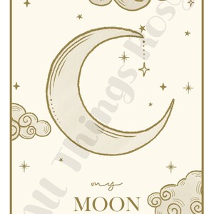 May include: A celestial-themed art print featuring a crescent moon, stars, and clouds in shades of gold and cream. The words "my MOON" are printed below the moon. The artwork has a vintage, hand-drawn style.