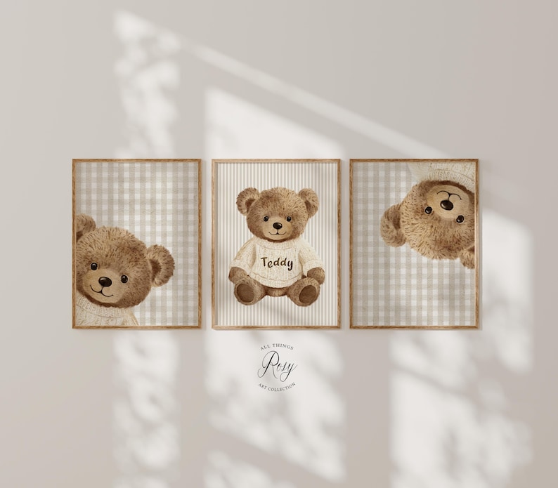 May include: Three framed prints with watercolour illustrations of teddy bears. One bear wears a sweater with the word "Teddy". The backgrounds feature neutral gingham and striped patterns. The artwork has a soft, muted colour palette.