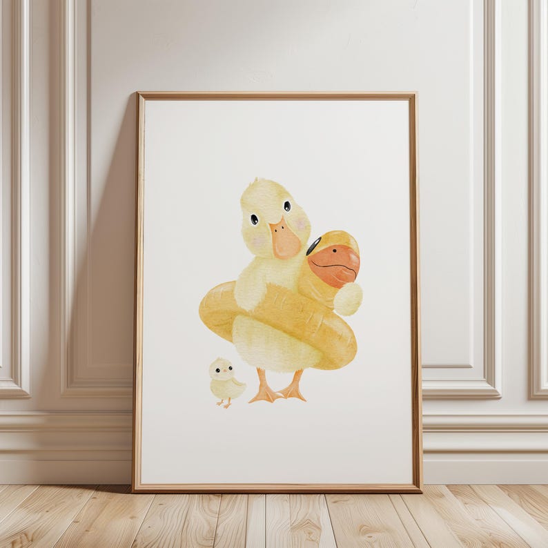 May include: Watercolor print of a duck family. A large yellow duck with a life preserver embraces a smaller duck. A baby duck stands nearby. The artwork is framed in a light brown wooden frame.