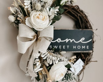 Front door wreath 18” creams, whites & black. Home sweet home sign