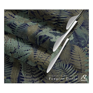 May include: Wallpaper featuring a dense pattern of fern leaves in shades of gold, sage green, and dark blue. The design includes the text EXQUISITE WALLPAPER Fougère Dorée and a logo. The paper is shown in overlapping rolls with white edges.