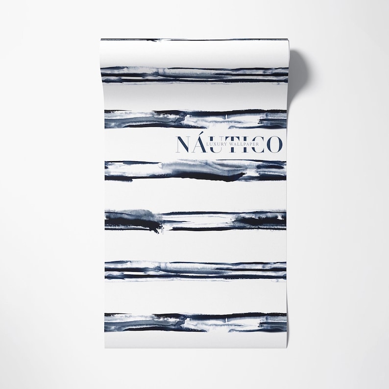 May include: A roll of white wallpaper with blue watercolor stripes and the text "N&Aacute;UTICO LUXURY WALLPAPER".