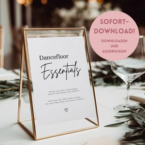 Könnte beinhalten: Ein goldgerahmtes Schild mit dem Schriftzug "Dancefloor Essentials". Das Schild enthält weiteren Text auf Deutsch und einen rosa Kreis mit den Worten "SOFORT-DOWNLOAD!" und "DOWNLOADEN UND AUSDRUCKEN!"
