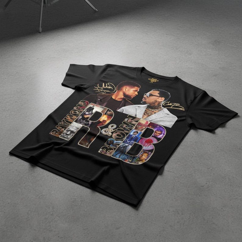 May include: Black t-shirt featuring a graphic design with the text "Raymond & Brown" in a collage style. The design includes images of two men and their signatures. The shirt is made of a soft material.