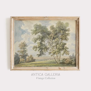 May include: A vintage watercolor painting of a landscape with trees, a field, and a distant village. The painting is framed in a light wood frame.