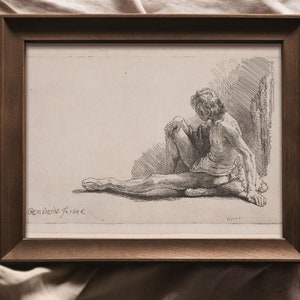 K&ouml;nnte beinhalten: Eine gerahmte Schwarzwei&szlig;zeichnung einer sitzenden Figur. Die Figur ist nackt und zeigt dem Betrachter den R&uuml;cken. Die Zeichnung ist signiert mit "Rembrandt F. 1646."