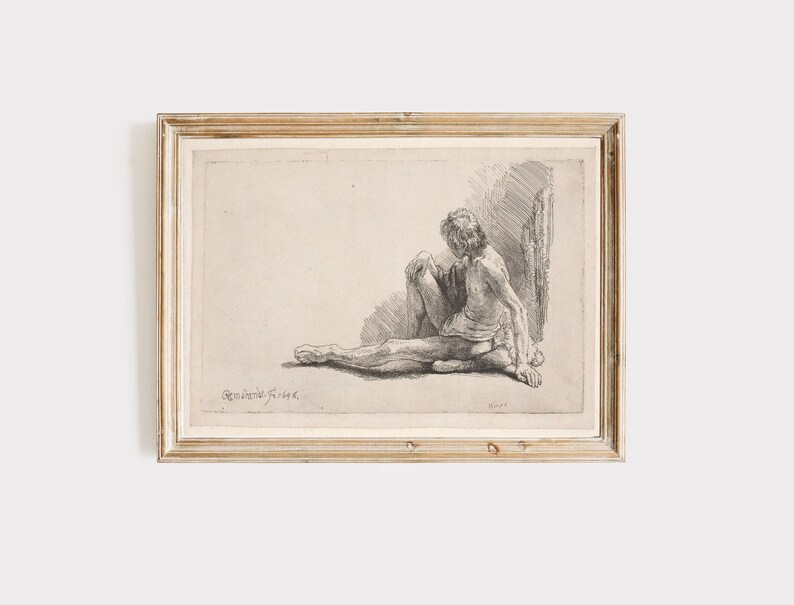 K&ouml;nnte beinhalten: Eine Schwarzwei&szlig;-Radierung einer sitzenden nackten Figur, gerahmt in einem hellen Holzrahmen. Die Radierung tr&auml;gt den Titel "Rembrandt f. 1646."