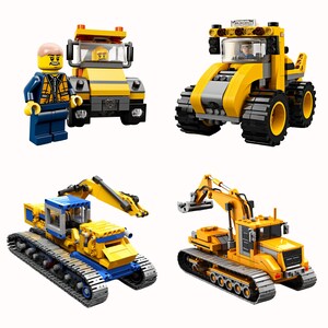 May include: Four yellow toy construction vehicles, including a bulldozer, an excavator, a dump truck, and a backhoe. The vehicles are made of plastic and have working parts. A small yellow Lego figure is standing next to the dump truck.