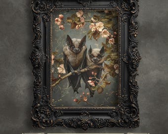 May include: A framed art print depicting two bats perched on a branch of blossoming pink flowers. The bats are brown and grey with large, black eyes. The background is a soft blue with a delicate floral pattern.