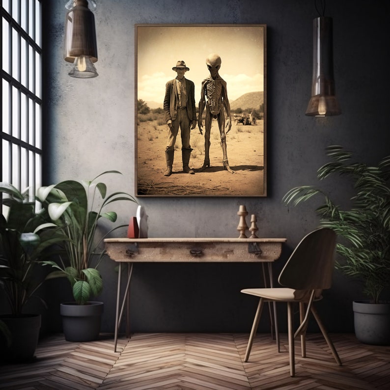 May include: A sepia-toned photograph of a man in a cowboy hat standing next to a tall, skeletal alien. The image is framed and hanging on a dark wall.