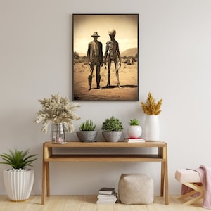 May include: A sepia-toned photograph of a man in a hat standing next to a tall, skeletal alien figure in a desert landscape.