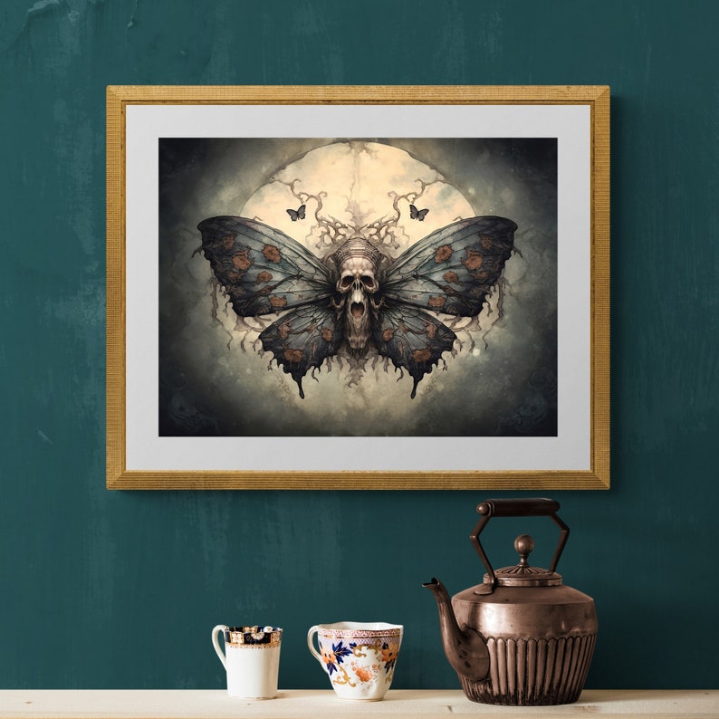May include: A framed print of a dark, gothic-style illustration of a skull with wings, resembling a butterfly, against a backdrop of a full moon and swirling clouds.