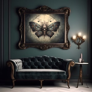 May include: A dark green room with a black velvet sofa and a framed print of a skull-faced butterfly with a moon and flowers in the background. The print is in a dark wood frame with ornate details. A small table with a lamp and decorative objects is to the right of the sofa.