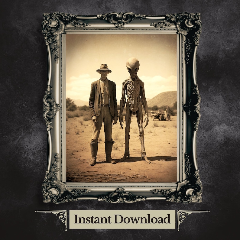 May include: A black and white vintage photograph in a silver ornate frame shows a man in a hat standing next to a tall, gray alien. The photo is set against a desert background. The text "Instant Download" is below the frame.