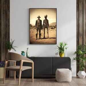 May include: A sepia-toned photograph of a man in a cowboy hat standing next to an alien in a desert landscape.