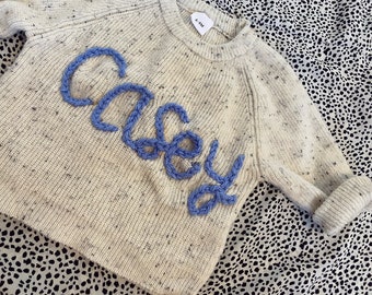 Personalised knitted jumper, Personalised baby/childrens jumpers, showcasing their Names. Choice of coloured jumpers and wool.Babynamejumper