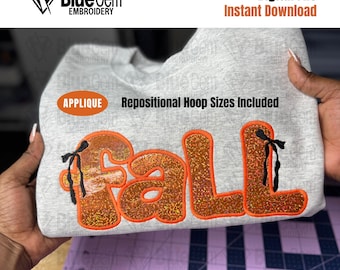 May include: A light gray sweatshirt with the word "FALL" embroidered in orange glitter letters. The design includes black bows and the text "Digital File Instant Download". The image also includes the text "Blue Gem Embroidery" and "APPLIQUE Repositional Hoop Sizes Included".